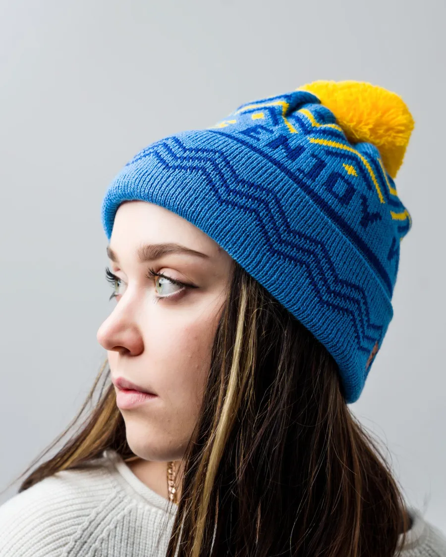 Beanie with a jacquard pattern and logo knitted into the fabric — custom design